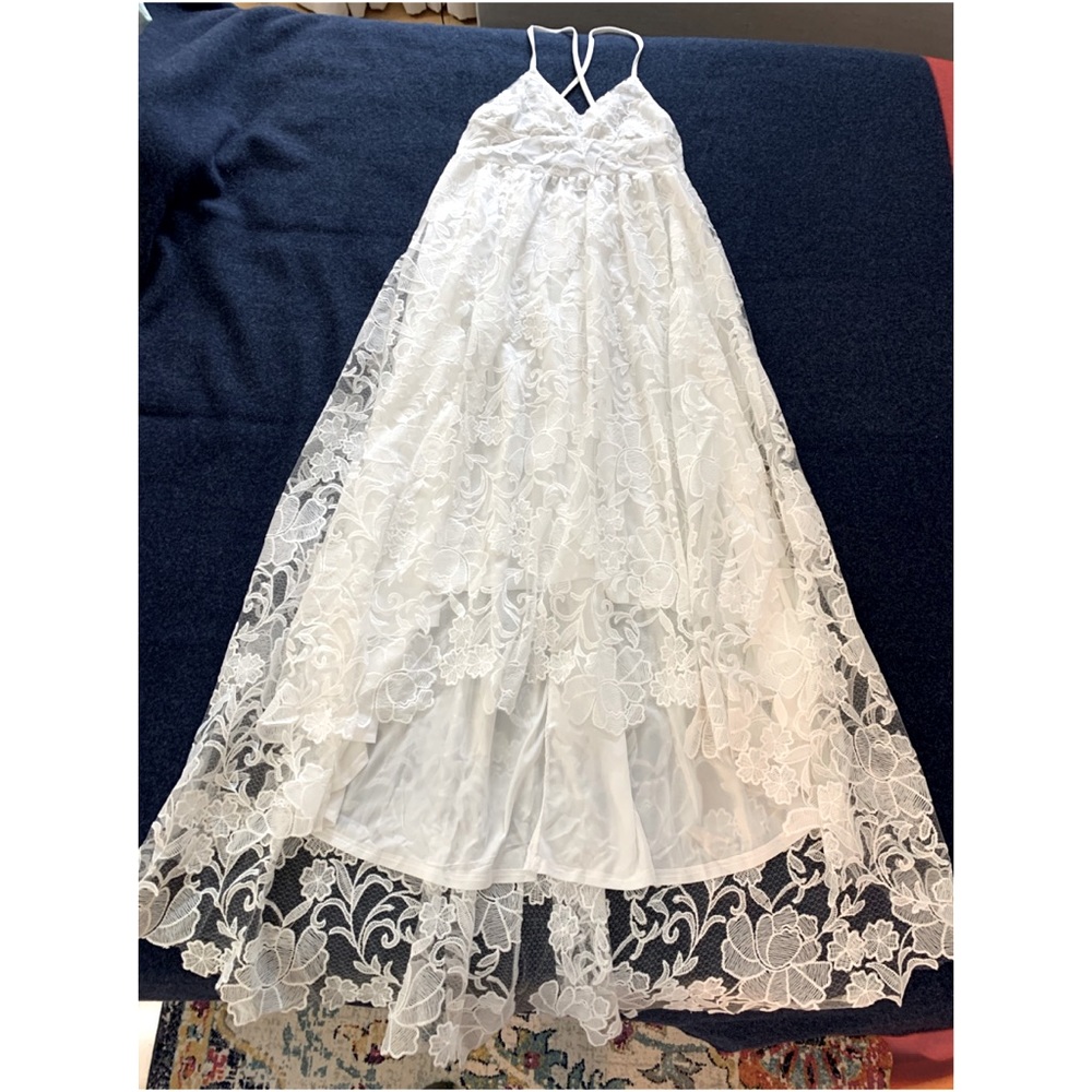 Bohemian white lace-floral pattern maxi dress. V-neck, X-back, single leg slit